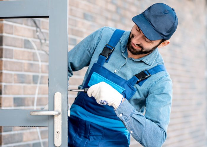 builder-installing-door-lock-ZBHCCAN-3